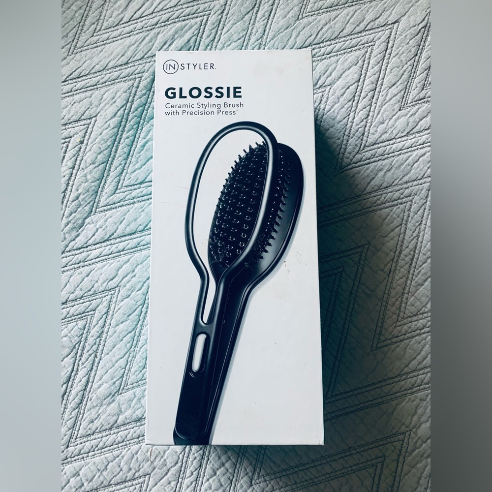 Brand new, never used. In original box. 

Glossie Ceramic Styling Brush